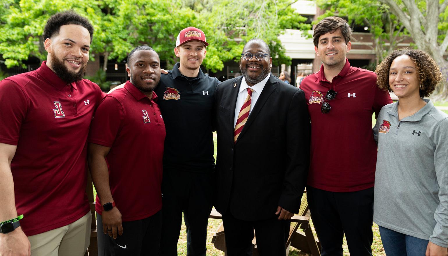 Xavier Cole mingles with staff and students on the Peace Quad.